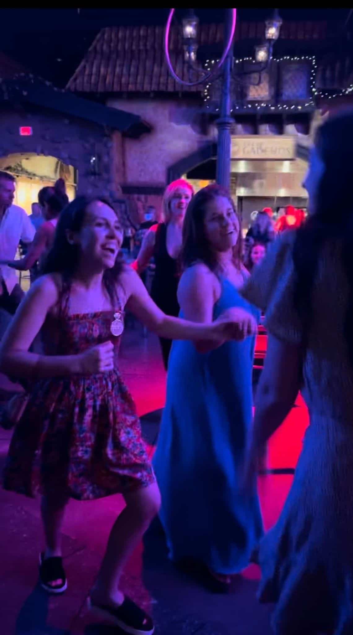 Two friends salsa dancing.