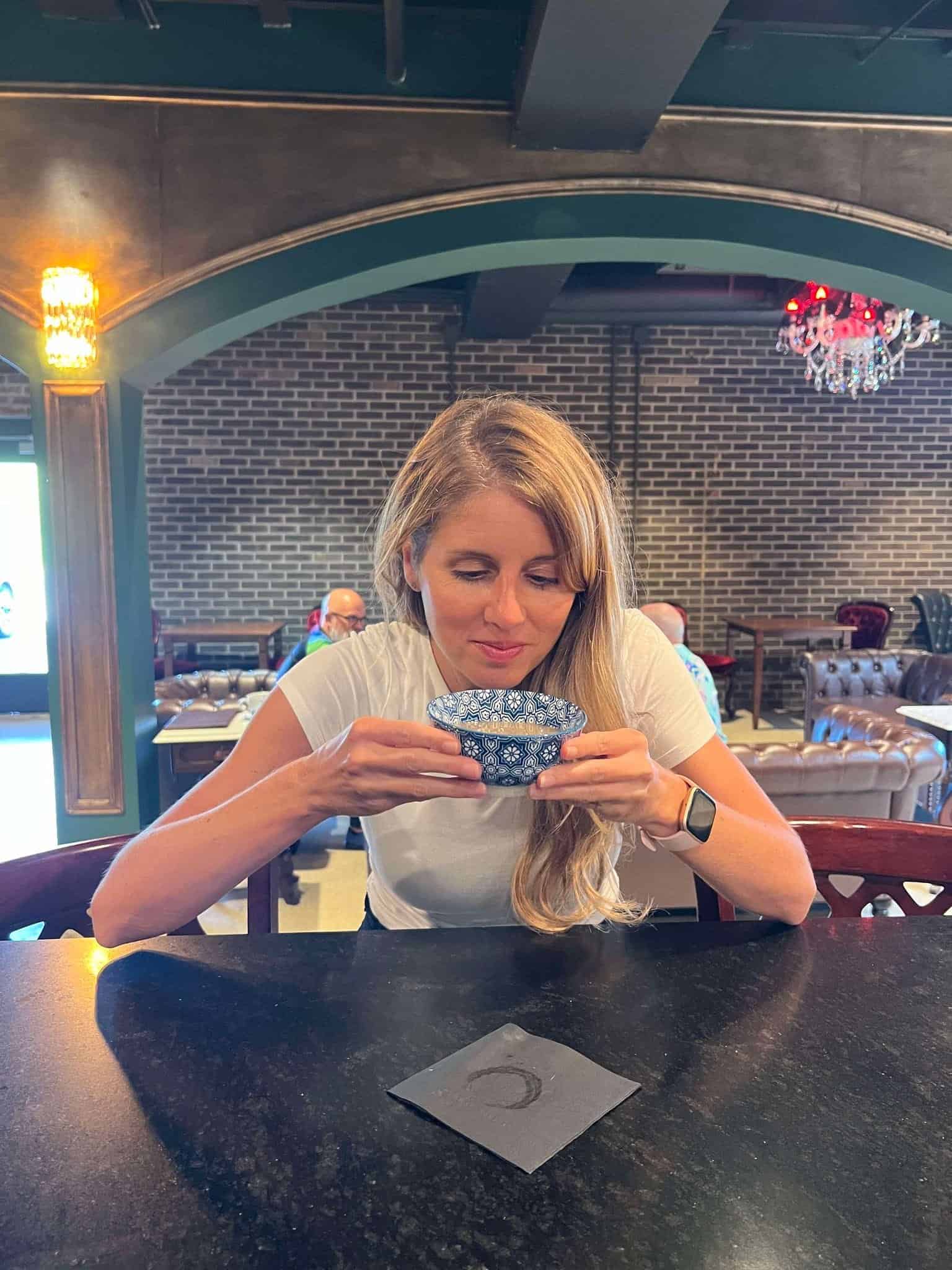 Girl trying kava at the non-alcoholic 21 and older non-drinking lounge in Nashville.