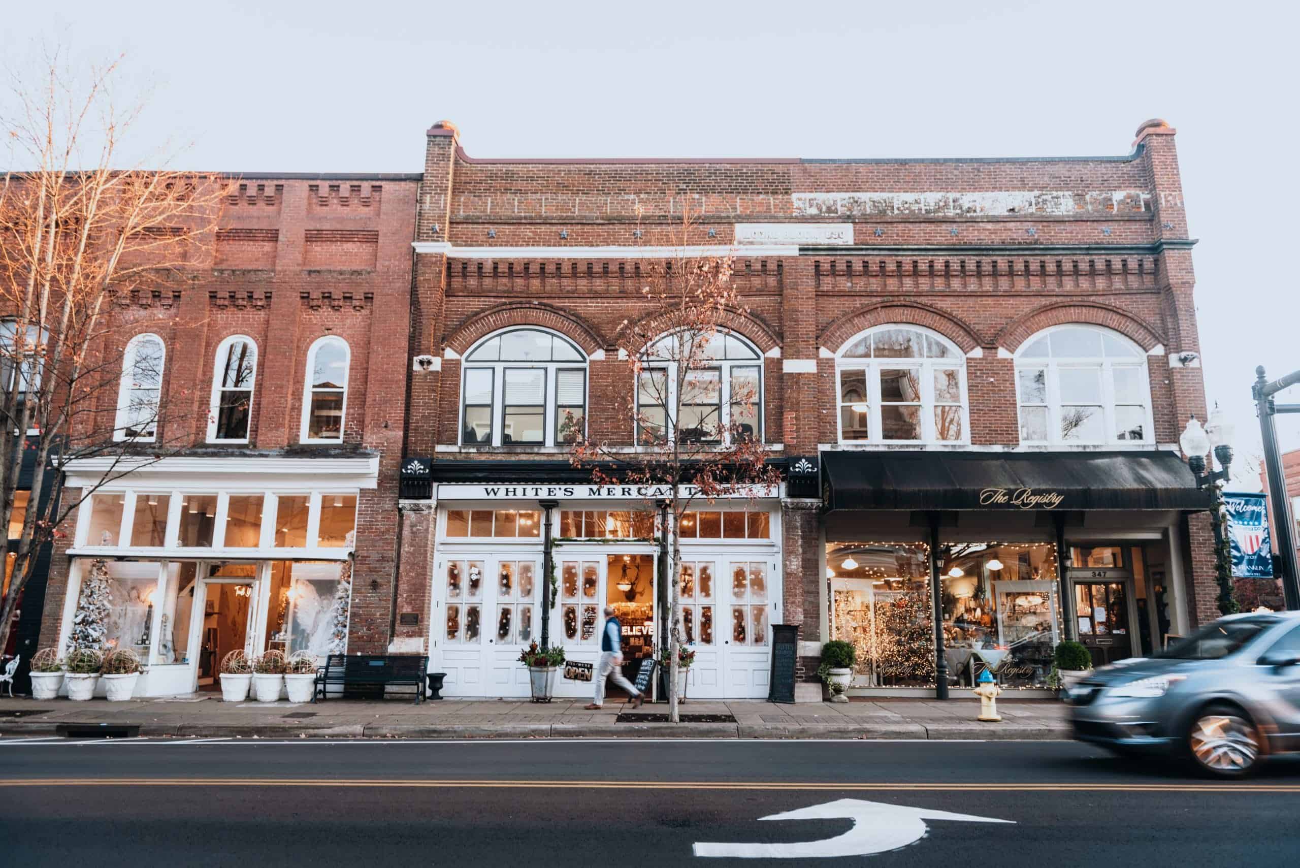 Outside photo of a brick building that houses White's Mercantile.