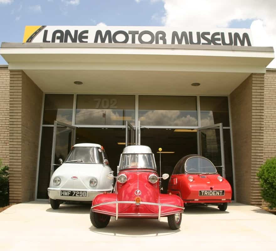 View of 3 cars at the Lane Motor Museum.