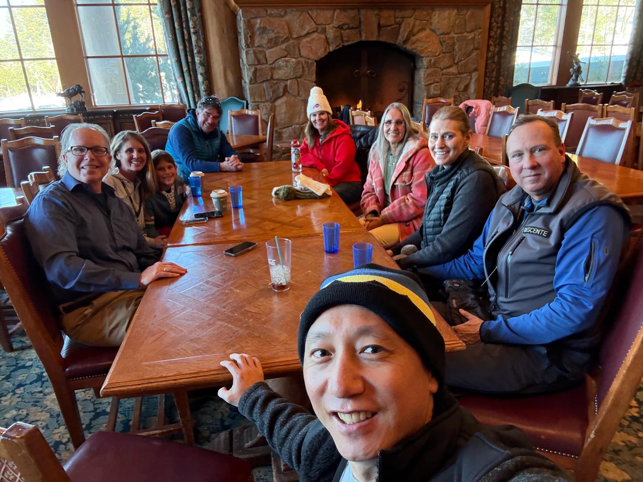 A group of 9 people meeting for chapel service at Snowbasin Ski Resort.