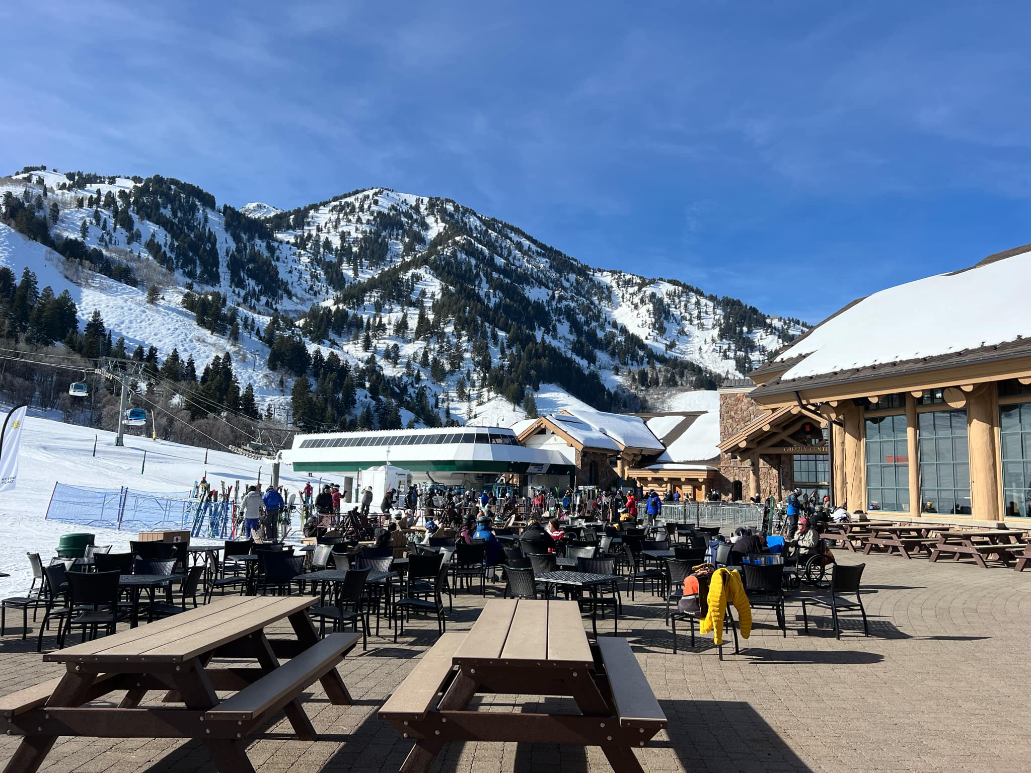 Outside tables and fire pits at Earl's Lodge at Snowbasin.
