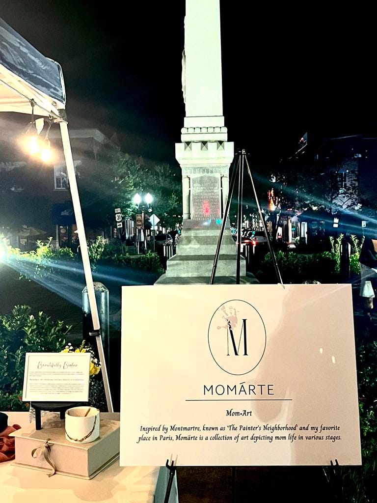 A sign of the art crawl booth that Natasha had called 'Momarte'.