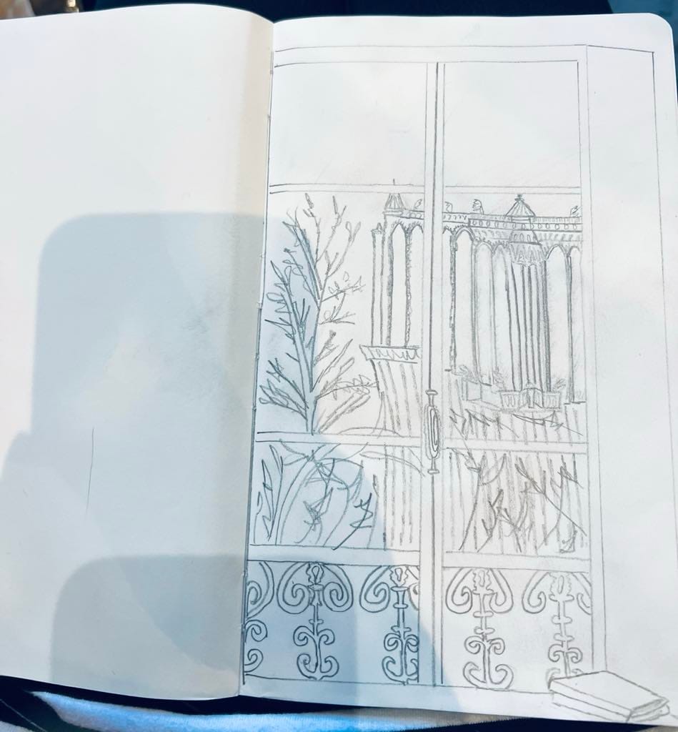 Photo of a sketchpad with a drawing of Notre Dame.