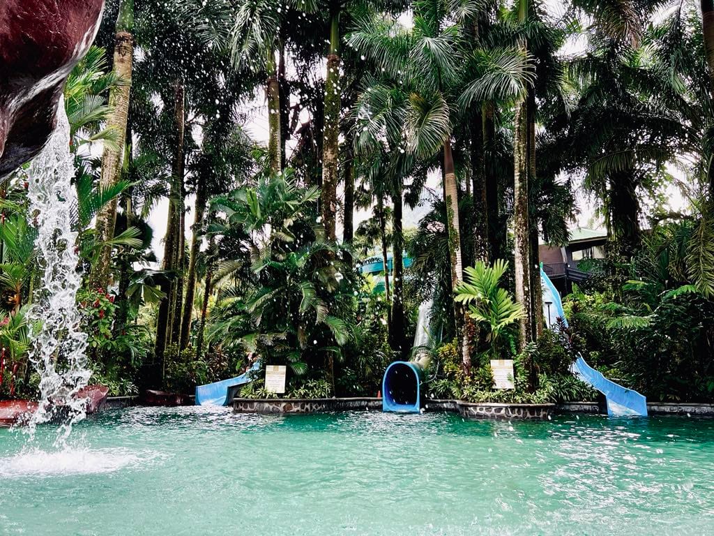 Three waterslides dumping into one of the hot spring pools at the Baldi Resort in Costa Rica.