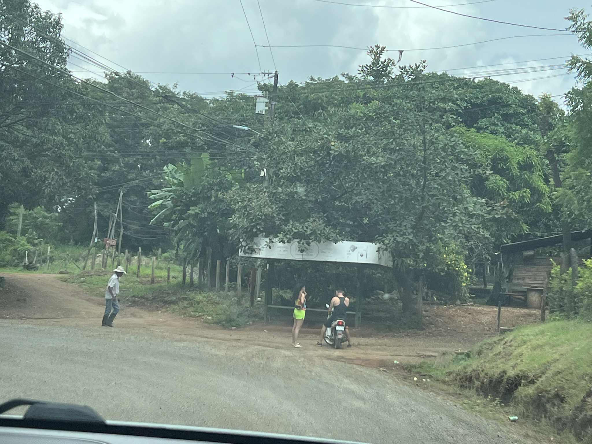 A view of the dirt roads and people walking.