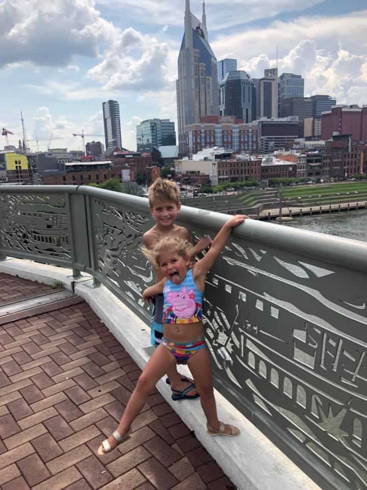 Two kids on the bridge making funny faces in downtown Nashville.