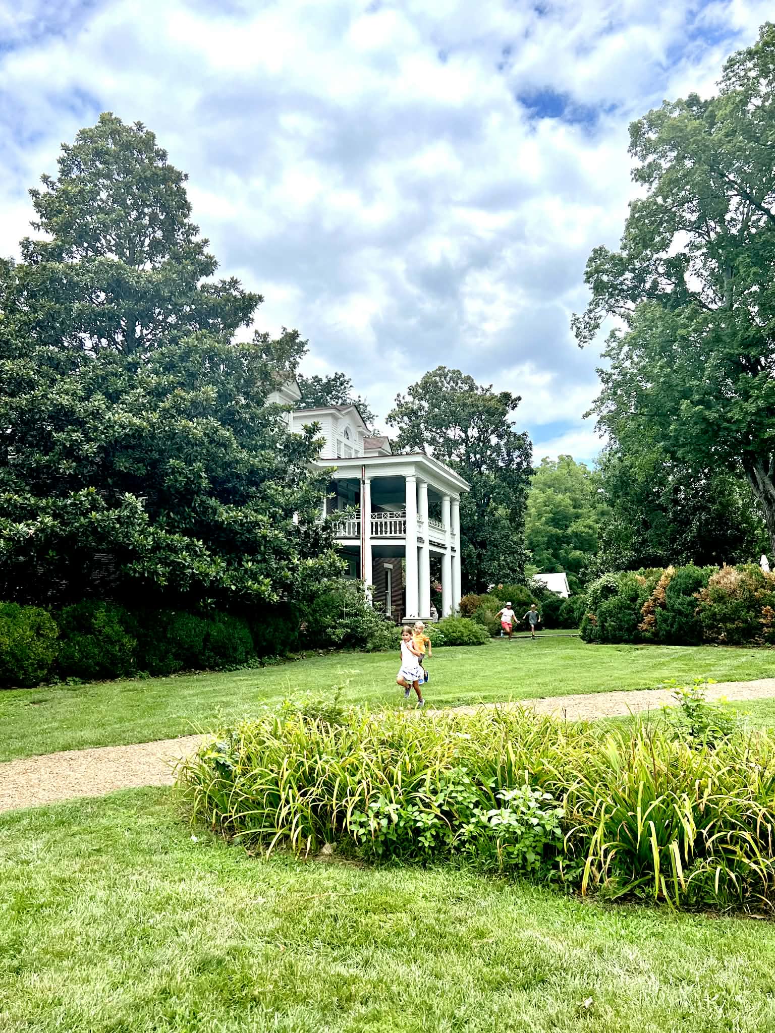 Two kids playing in the front yard of this Nashville coffee shop.