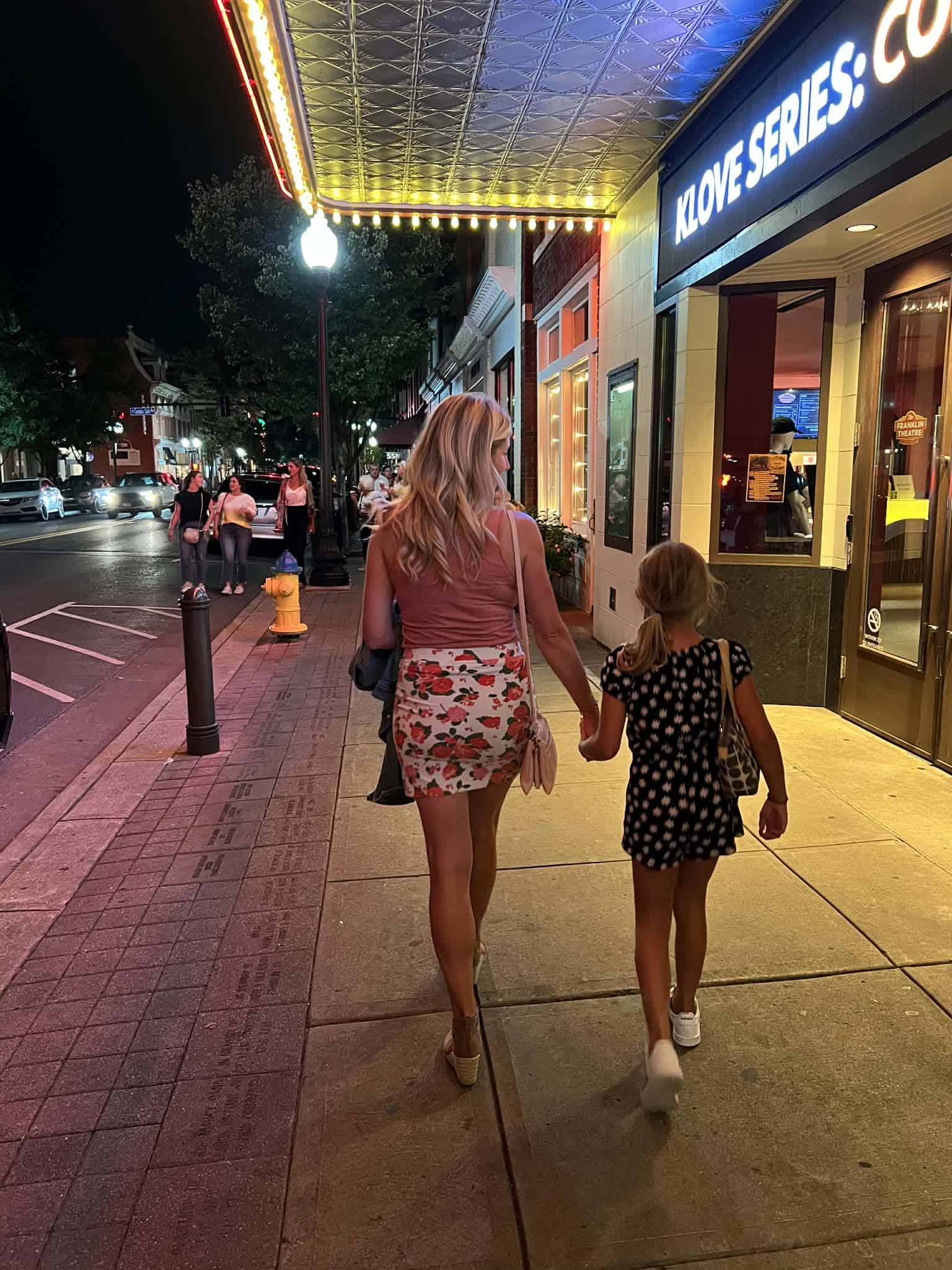 A mom walking with her daughter downtown Franklin.