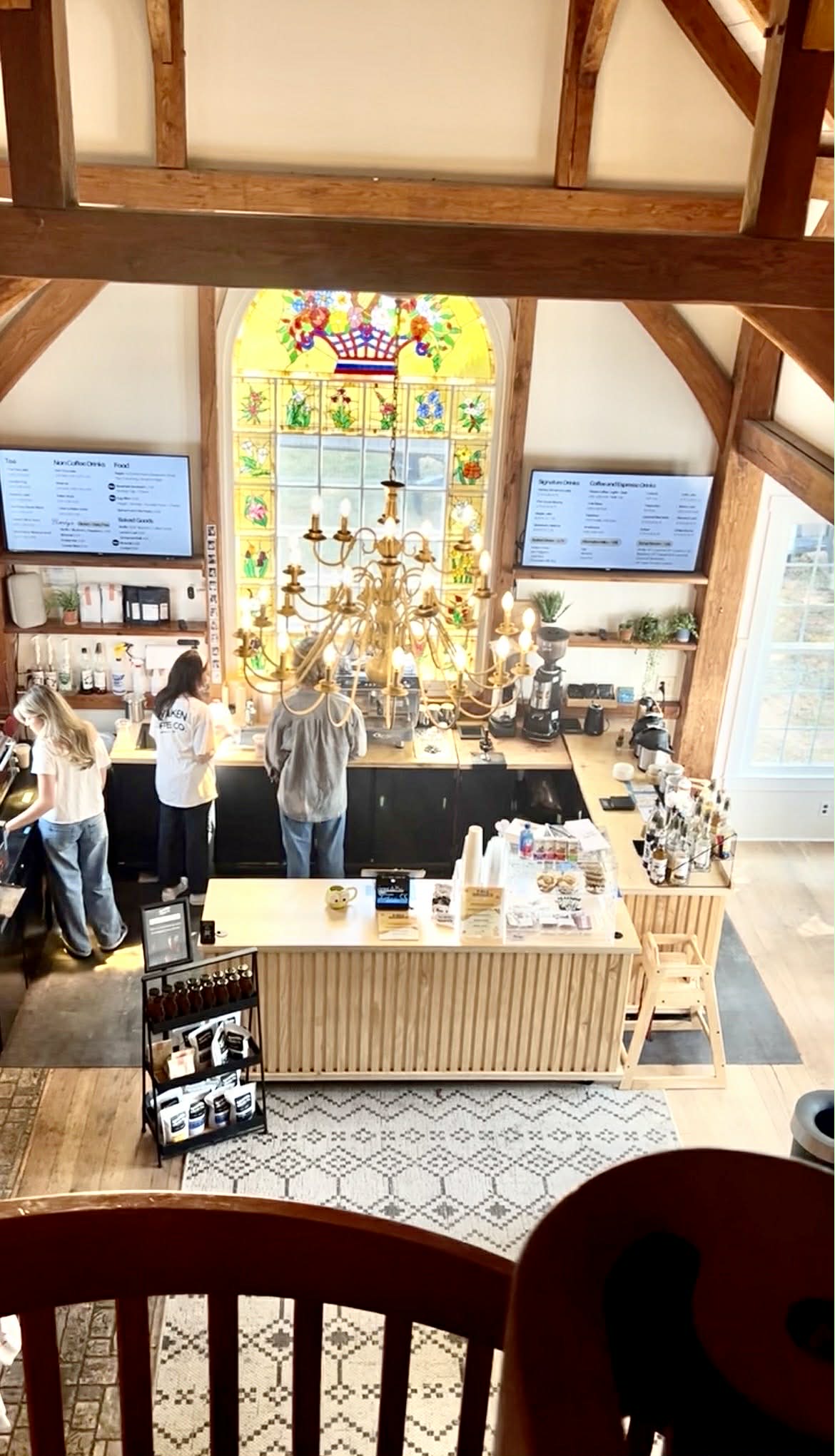 An above view of the coffee shop that has stained glass windows.