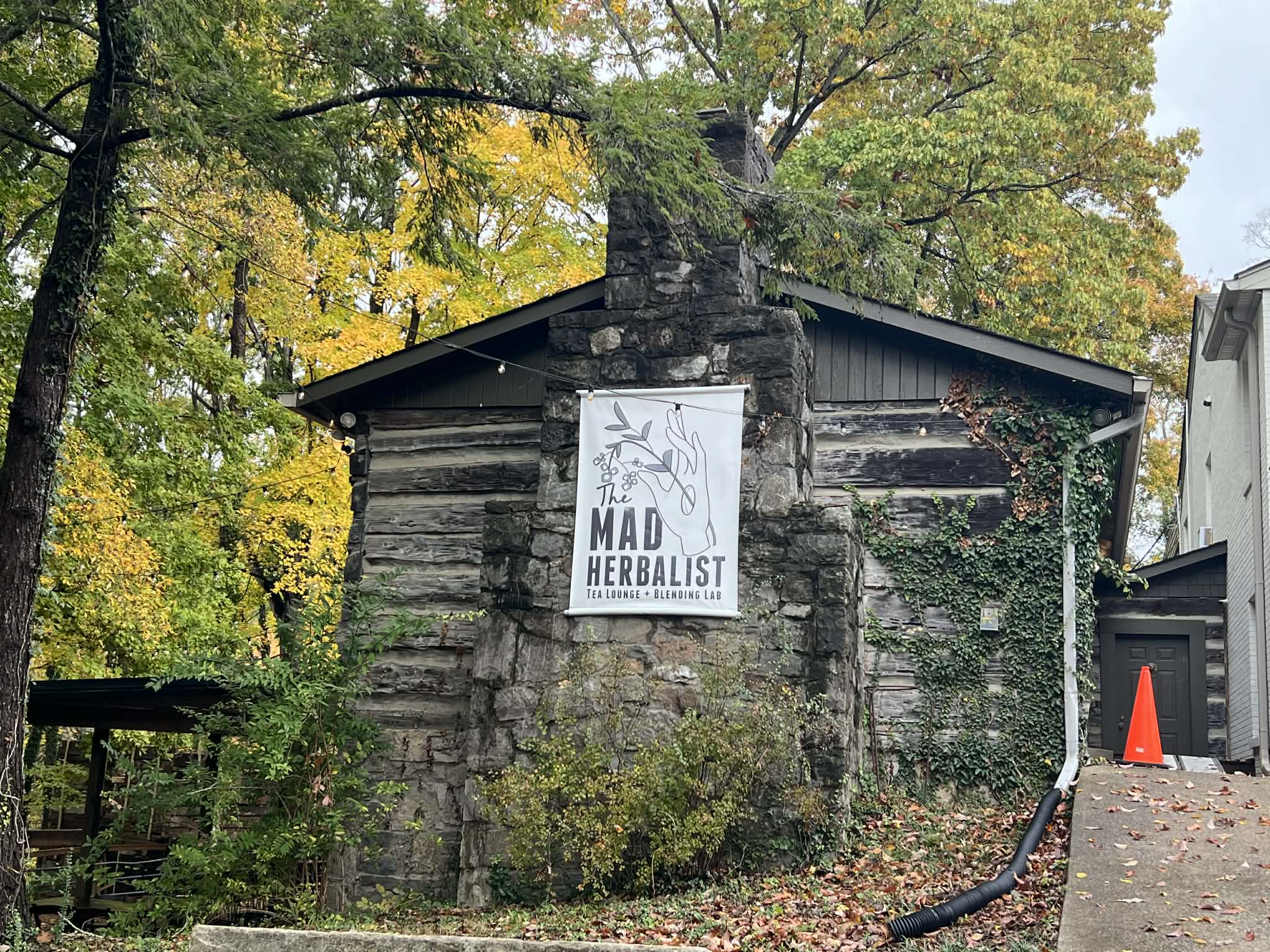 An old log cabin that has been turned into a tea room.