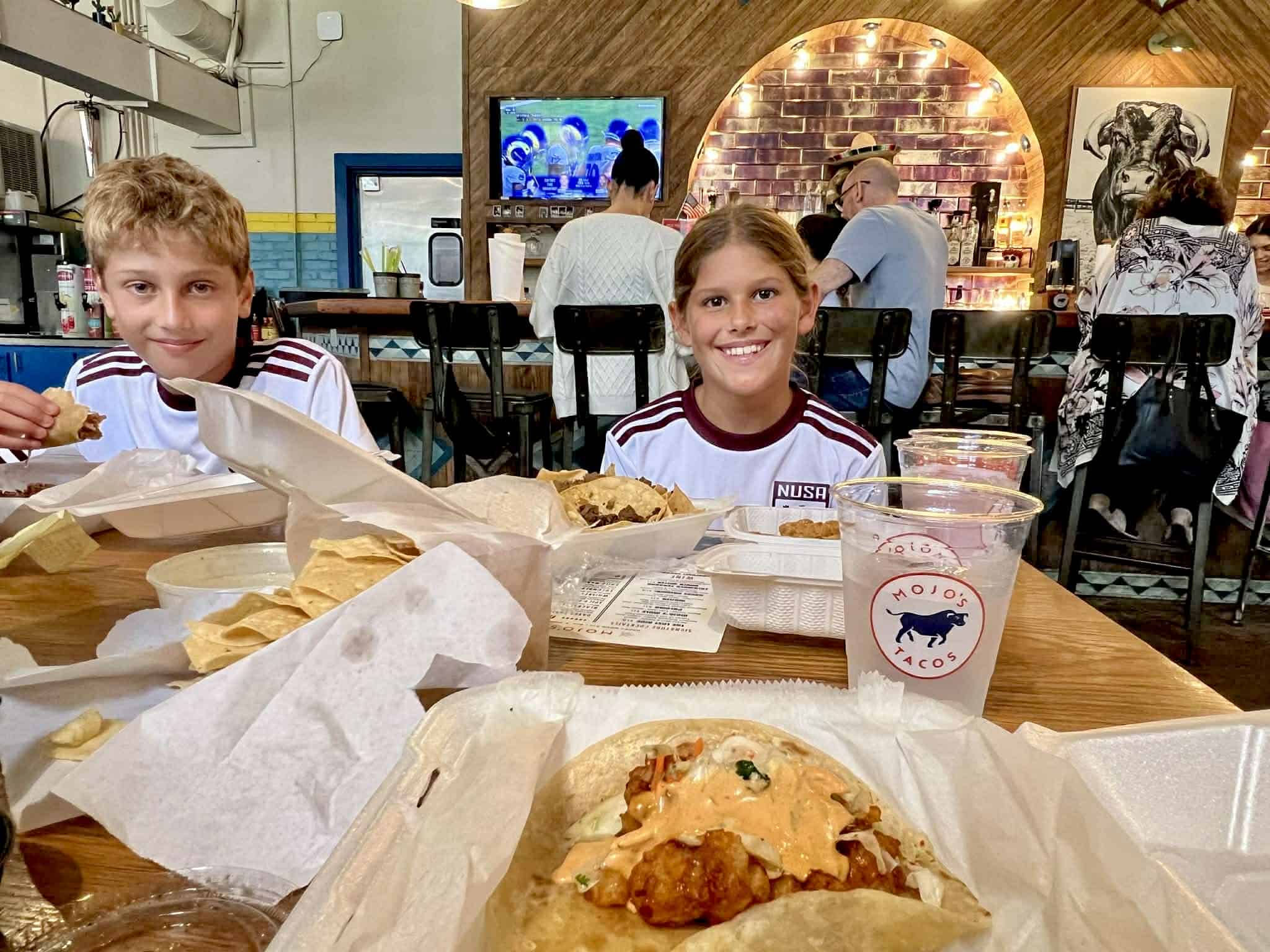 Two kids eating at Mojo Tacos in Franklin.