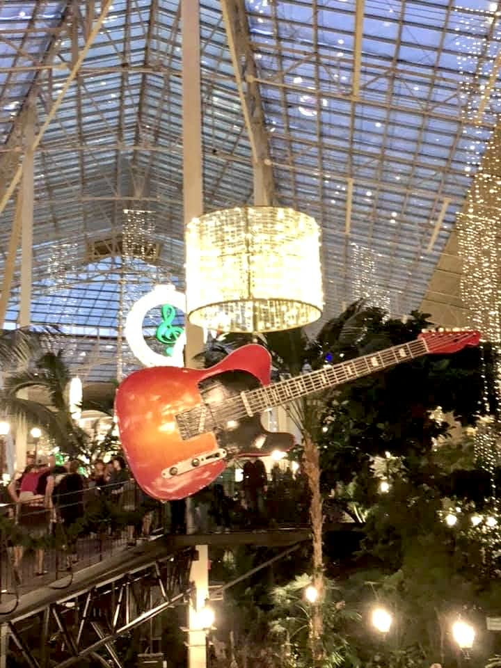 A hanging guitar inside Gaylord Opryland Hotel.