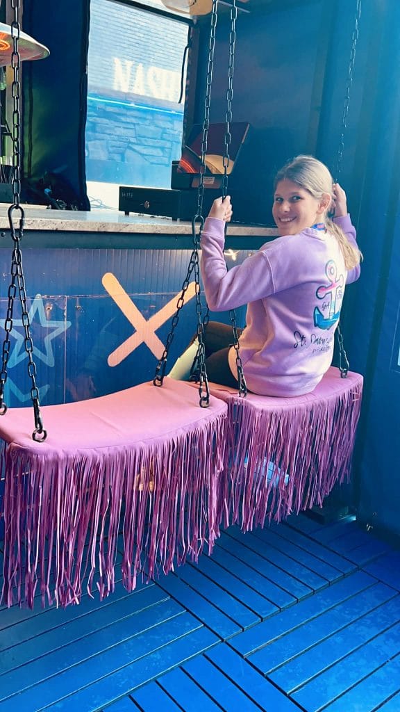 Play Playground has swings that the kids can sit on. The swings are pink with pink fringe.