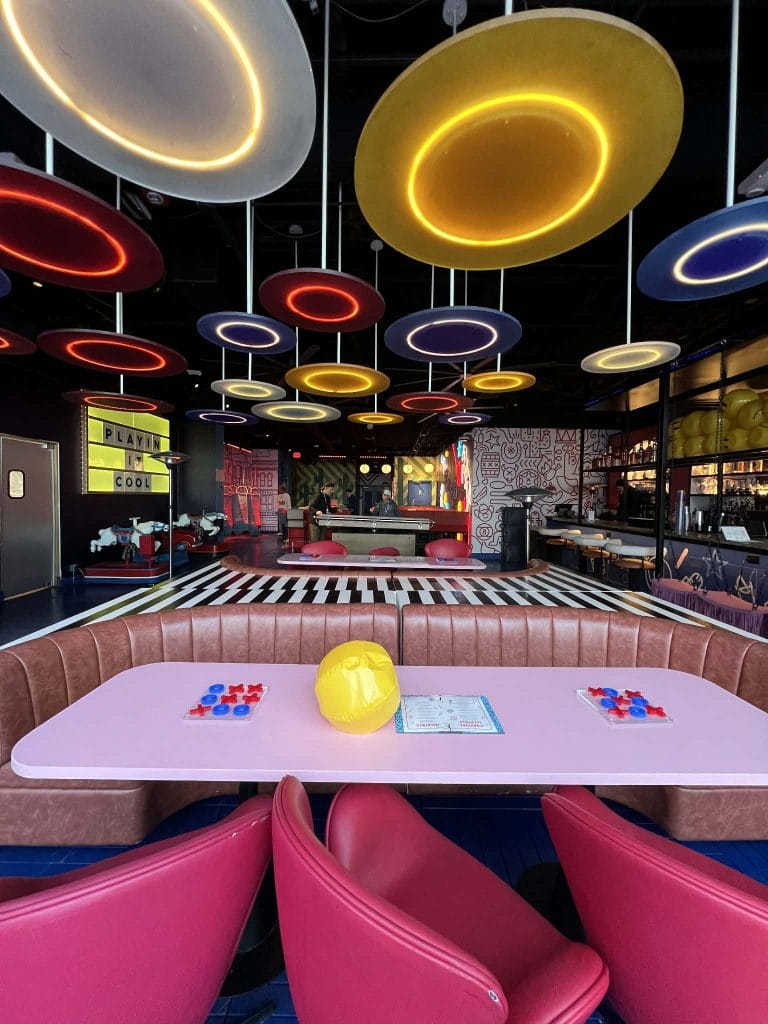The decor of Play Playground is bright and fun with lots of neon signs.