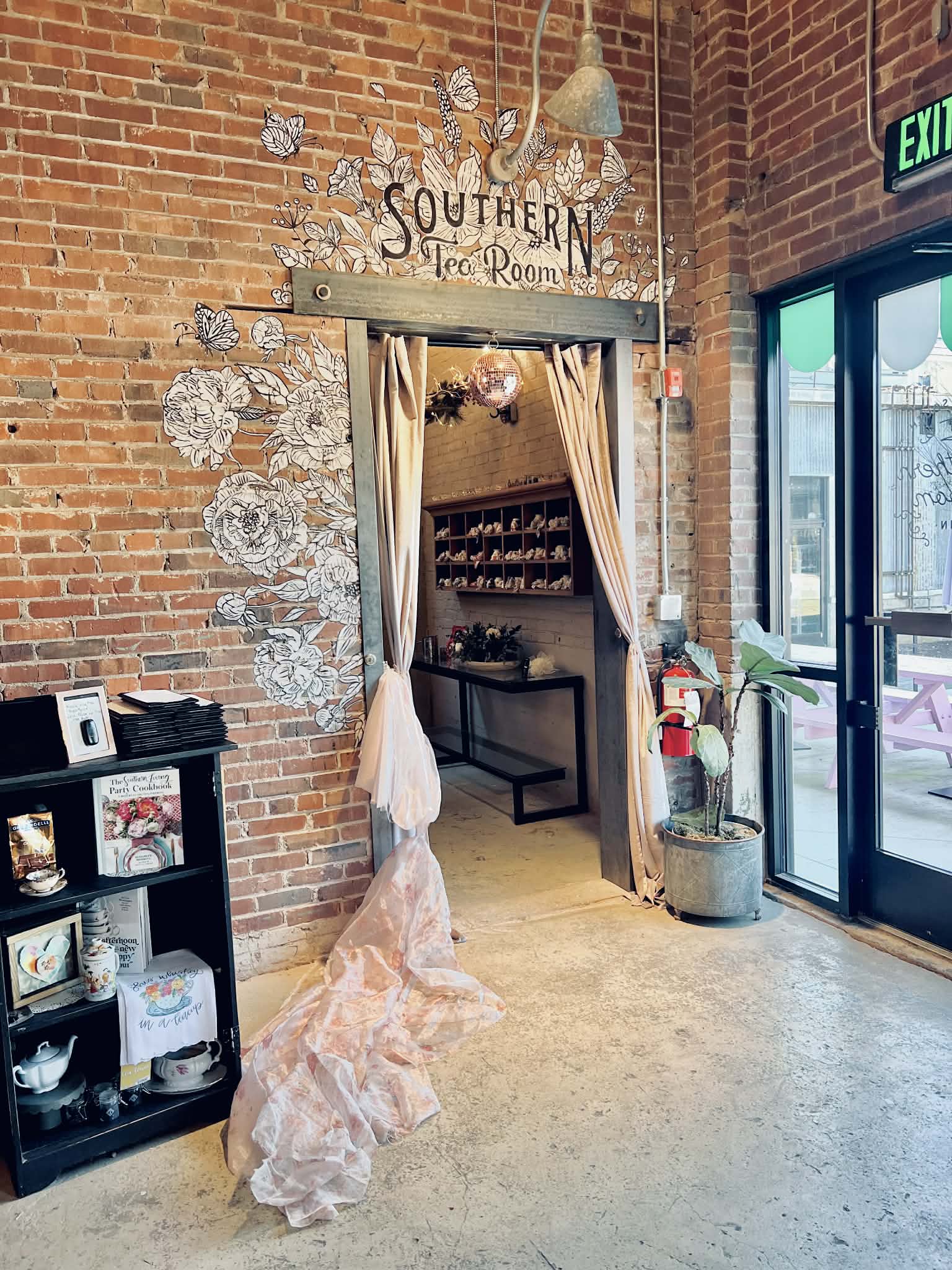 The entrance of The Southern Tea Room where a big fabric is welcoming the guests.