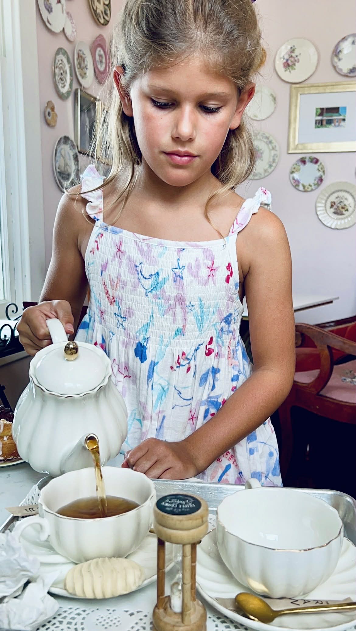 A little girl pouring tea at this Nashville tea room.
