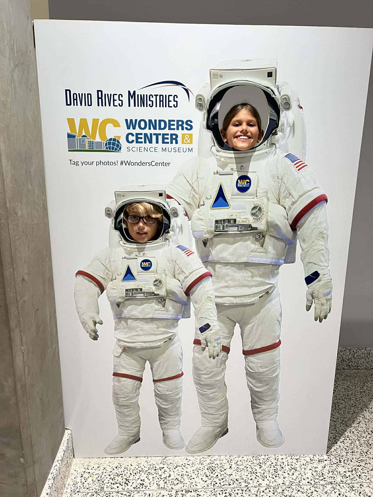 Two kids posing as astronauts.