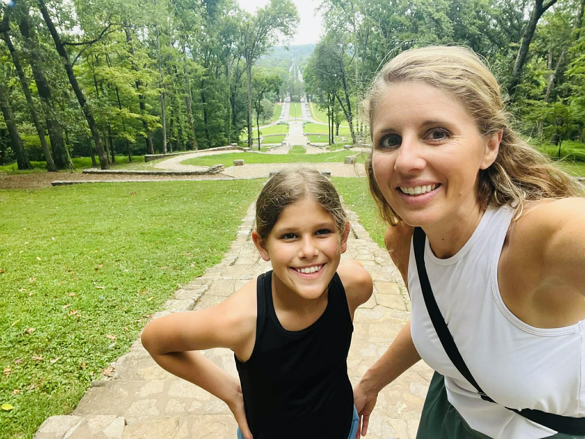 A mom and daughter hiking.