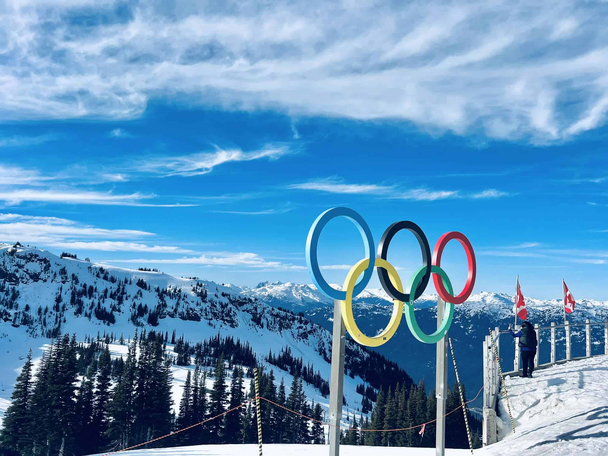 Olympic rings in front of a beautiful snowy backdrop at Whistler mountain.