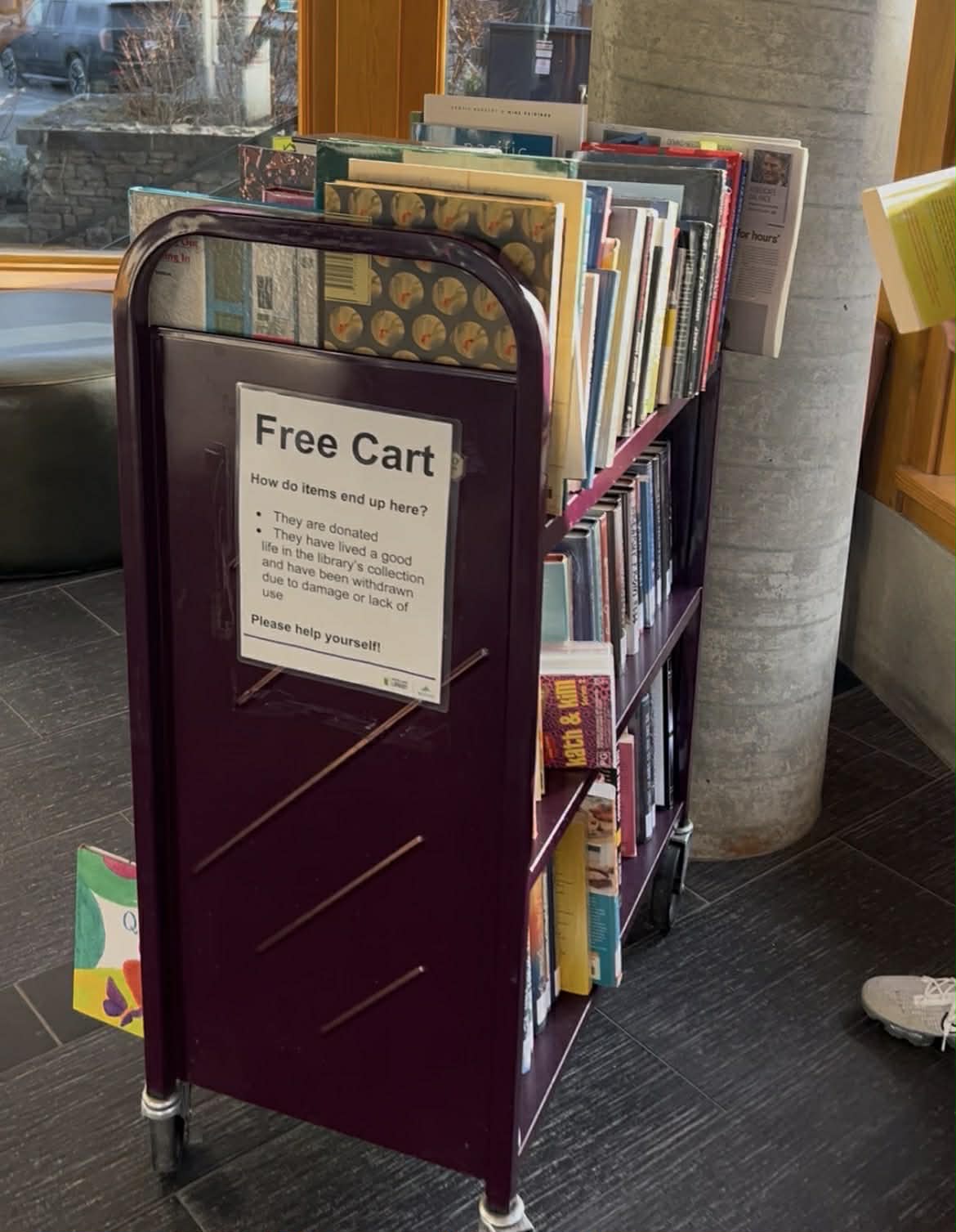 A library cart with free books at the Whistler library.