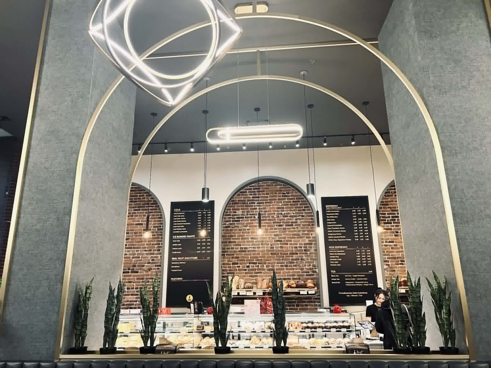 The inside of Breka Bakery in Vancouver. Arched walls and gold trim make it beautiful.