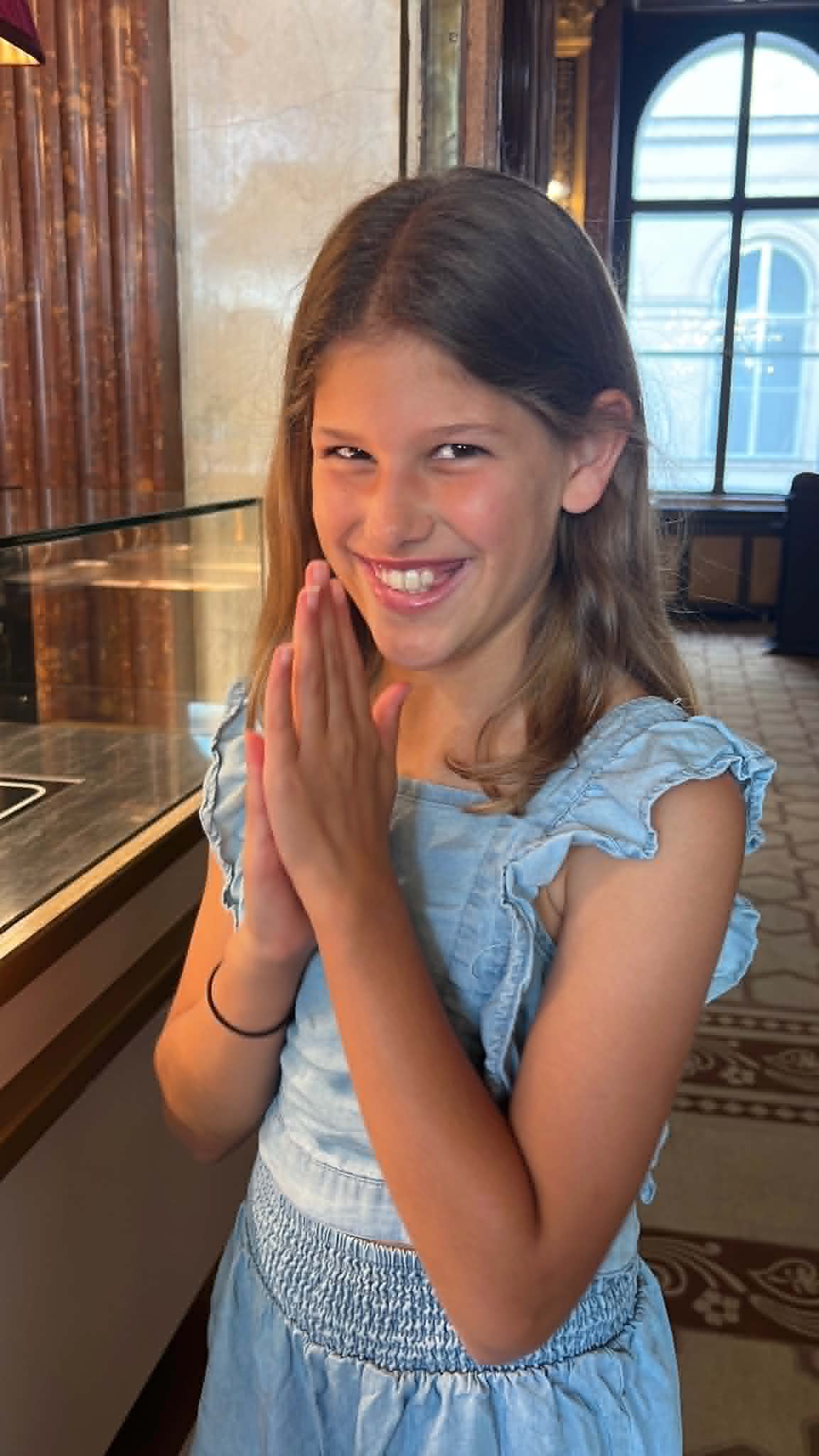 Girl rubbing her hands together, planning to get an apple strudel.