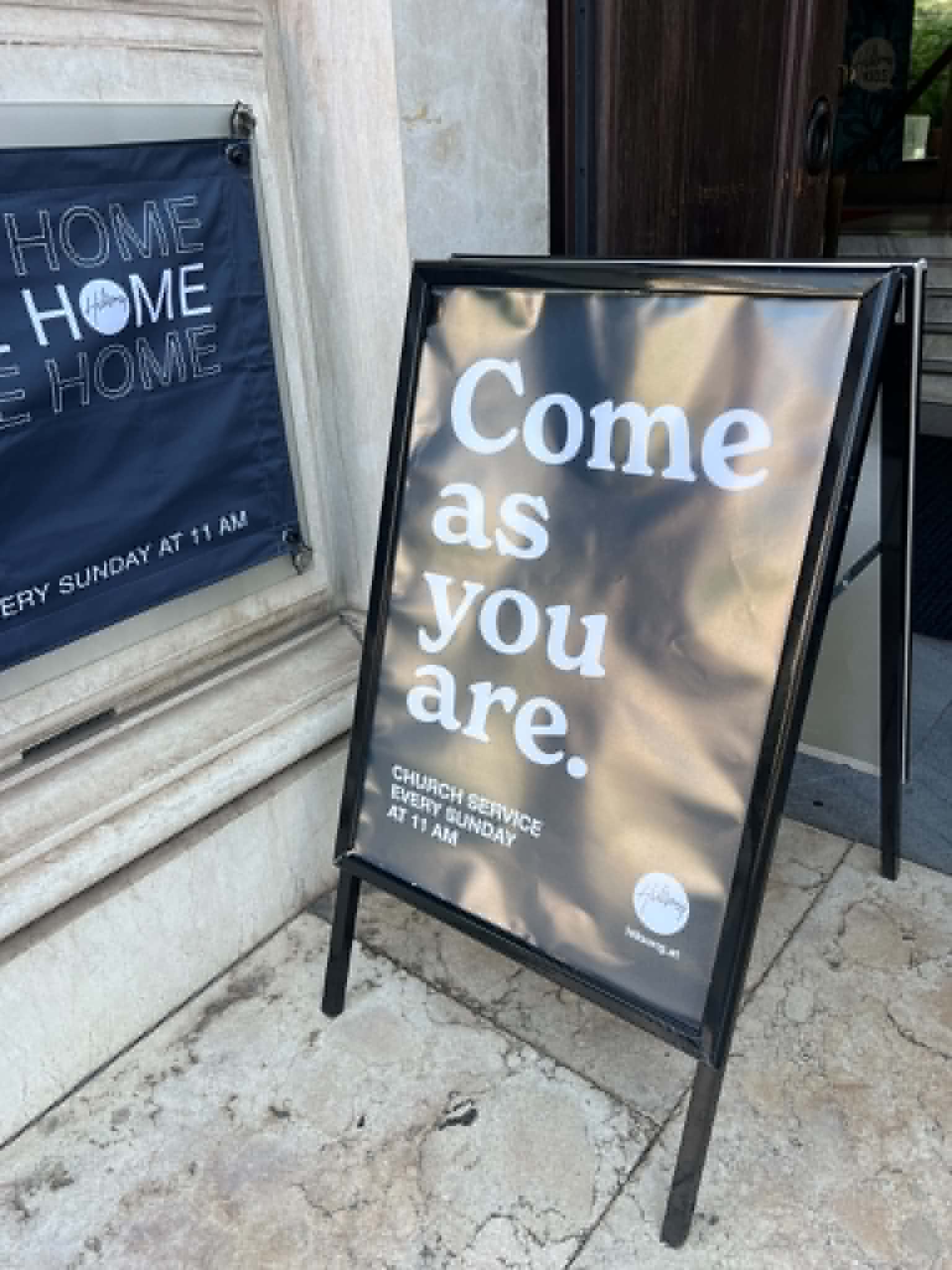 Church service sign saying come as you are.
