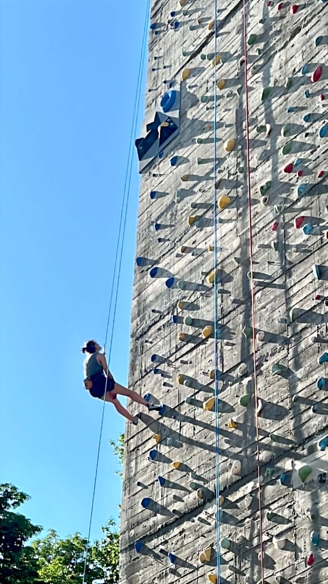 Girl rock climbing.
