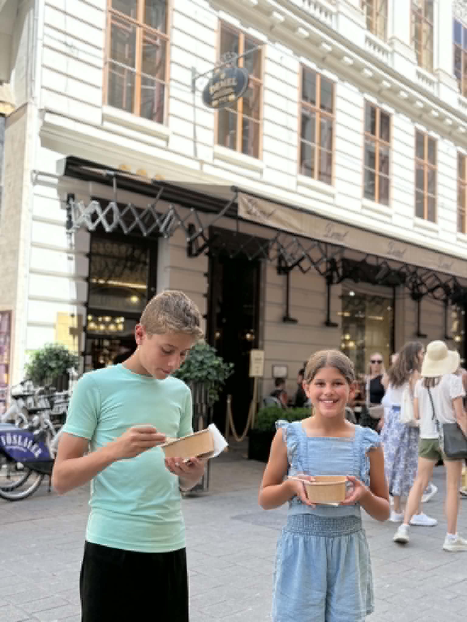 Boy and girl enjoying there dessert.