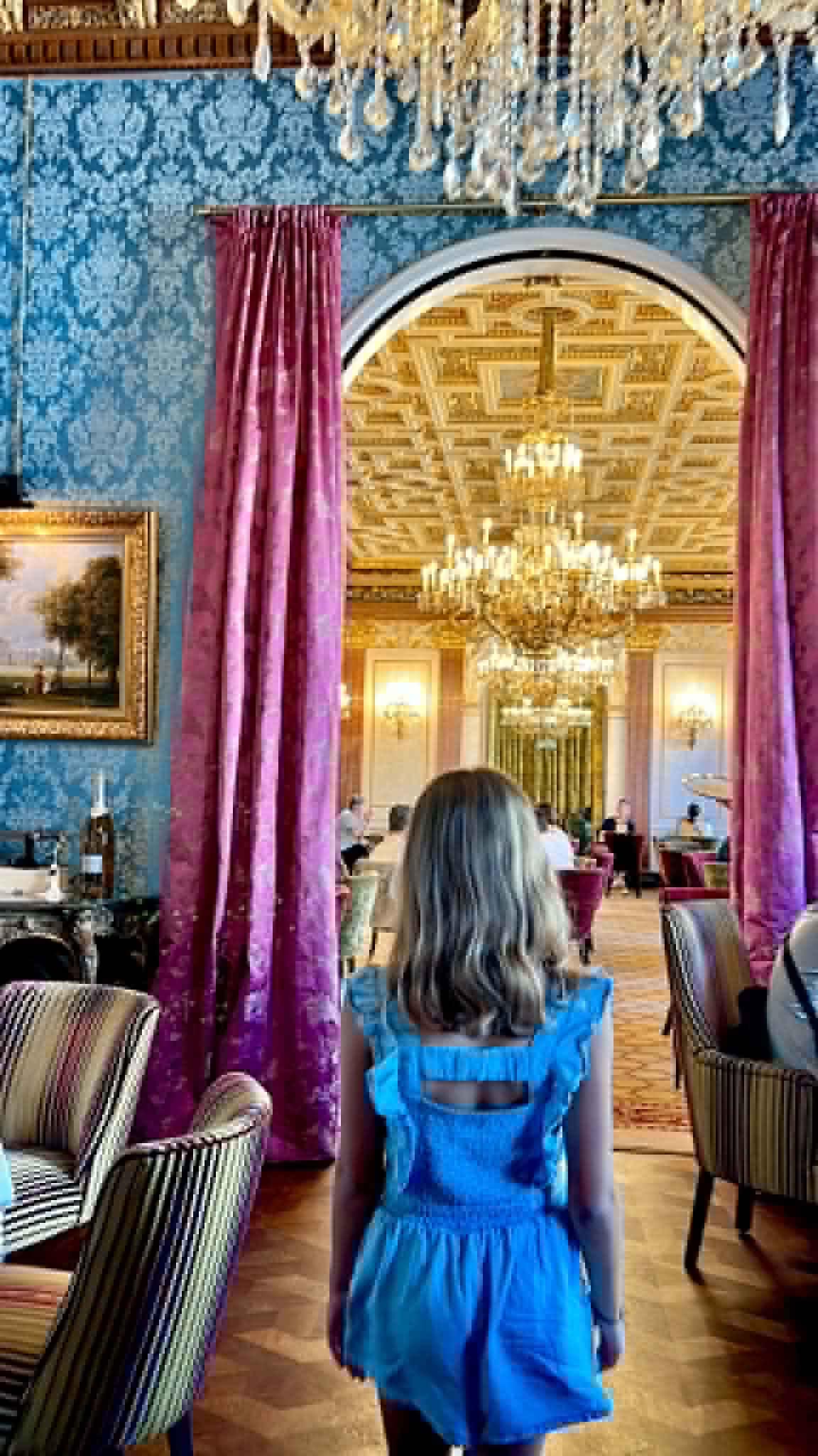Girl walking in beautiful restraunt.