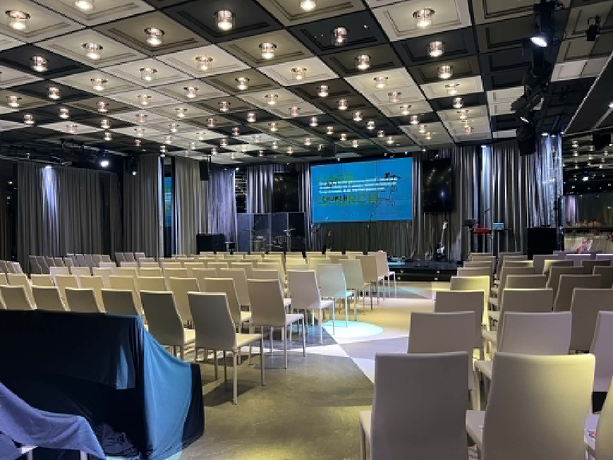Church room with white chairs.