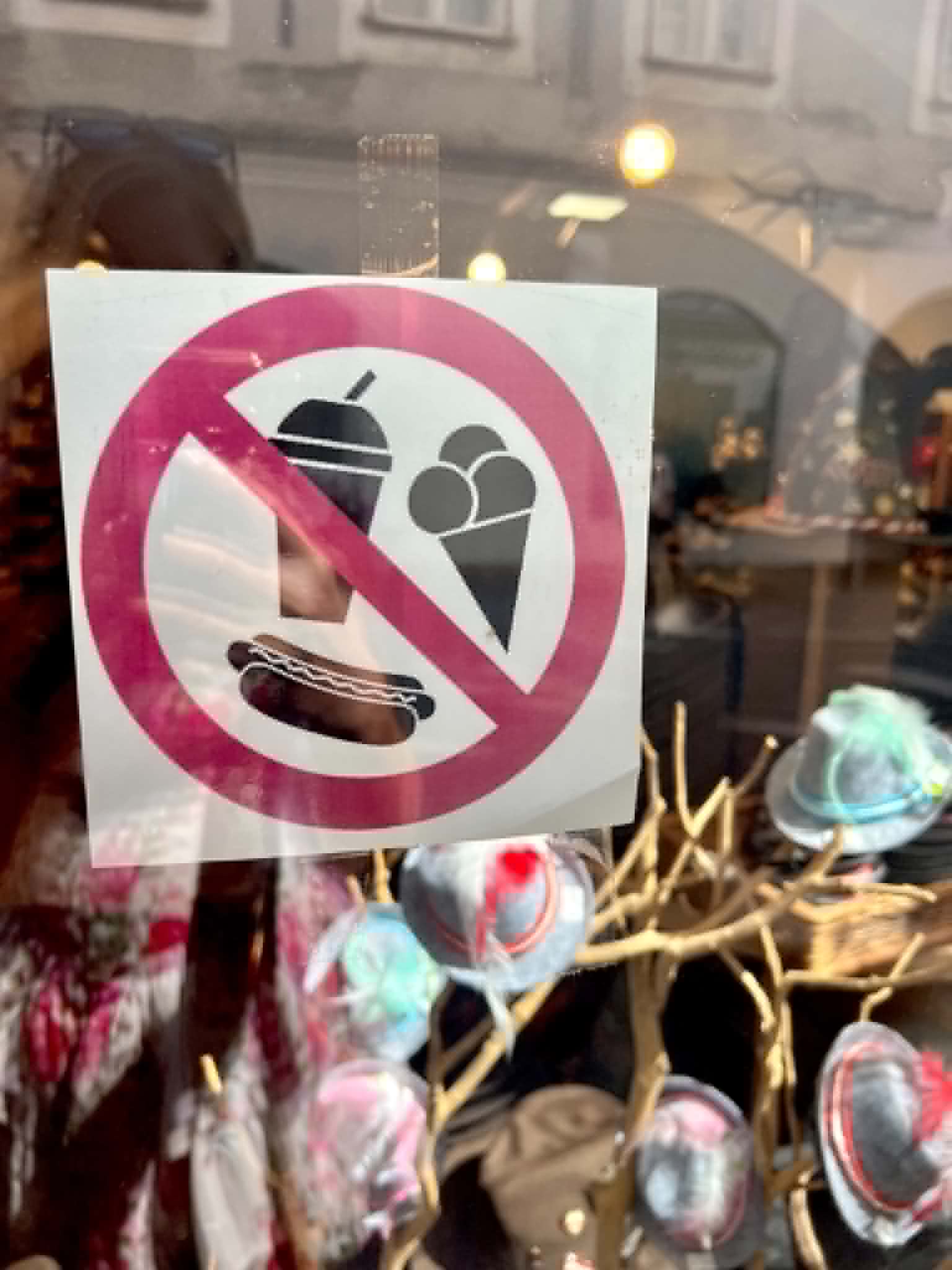 Fancy place with a sign saying no ice cream, food, or drinks.