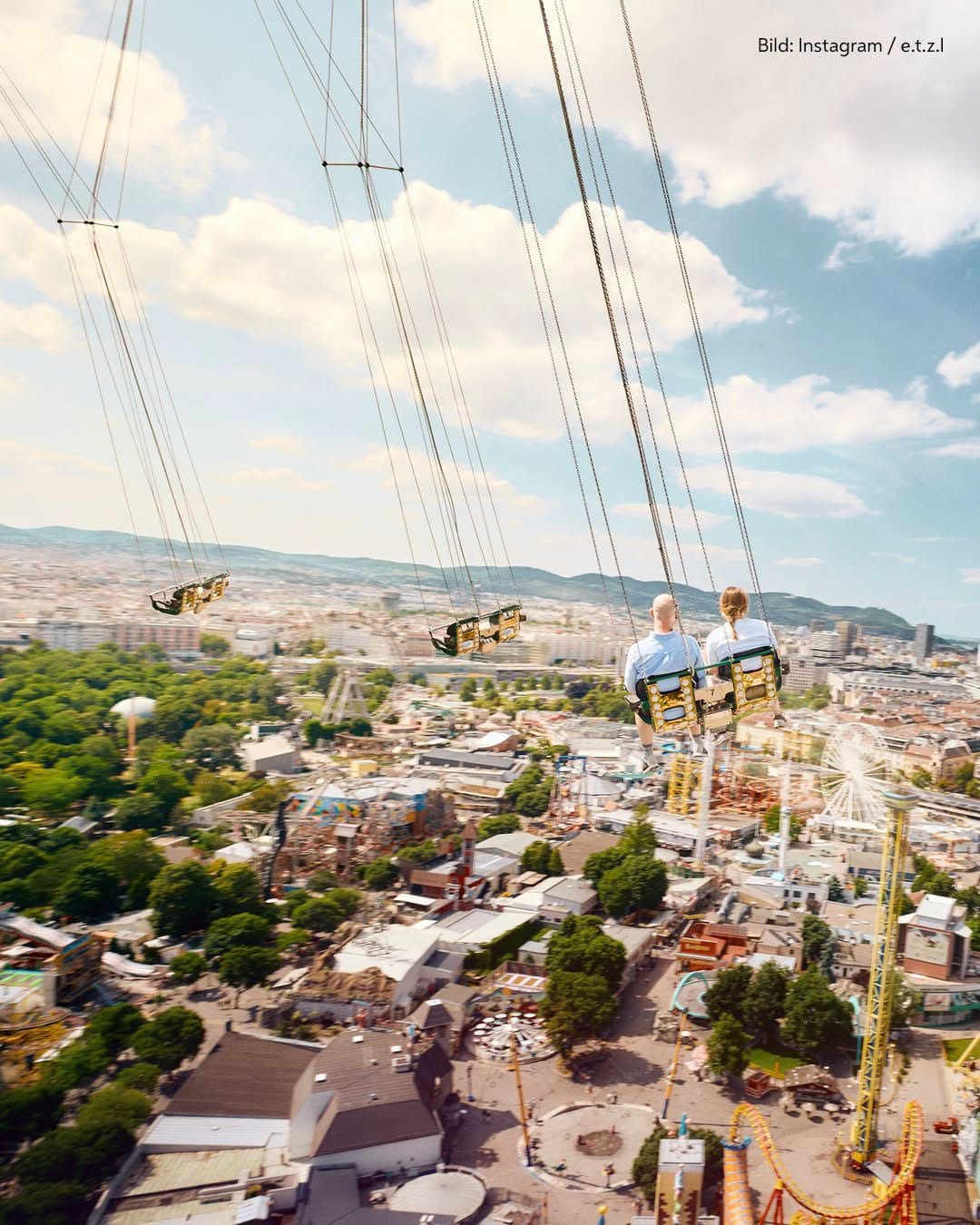 Swings overlooking Prater amusement park and the city of Vienna.