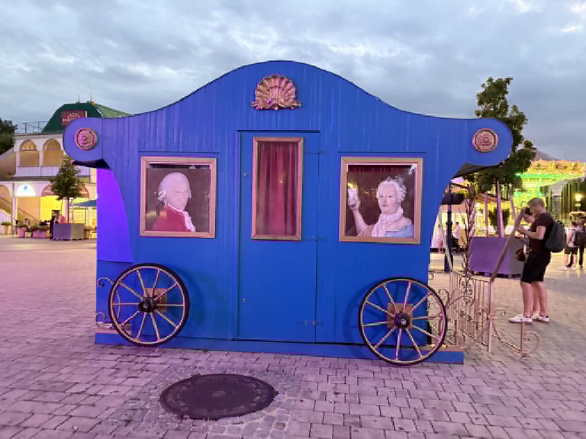 Cute wooden carriage with Mozart in it.