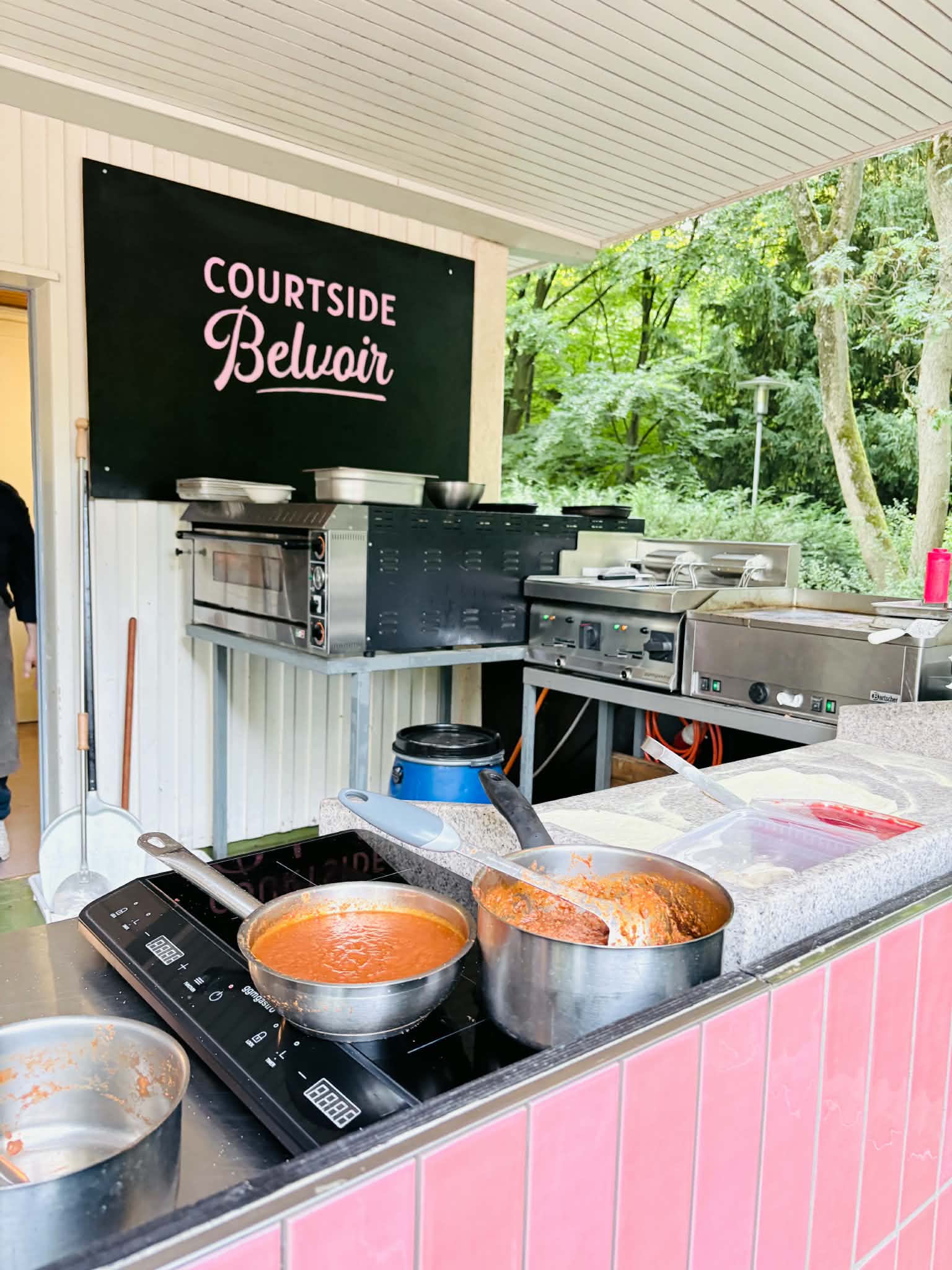 The outdoor kitchen at Courtside Belvoir where pizza and pasta are being made.