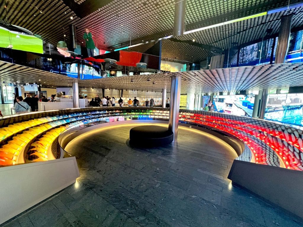 A huge u-shaped exhibit at the FIFA Museum showcasing all of the different futbol jerseys from around the world.