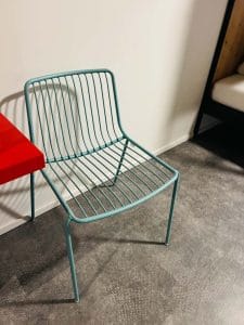 A photo of the really uncomfortable chair at Meininger Hostel in Zurich. It is just bars and no cushion.