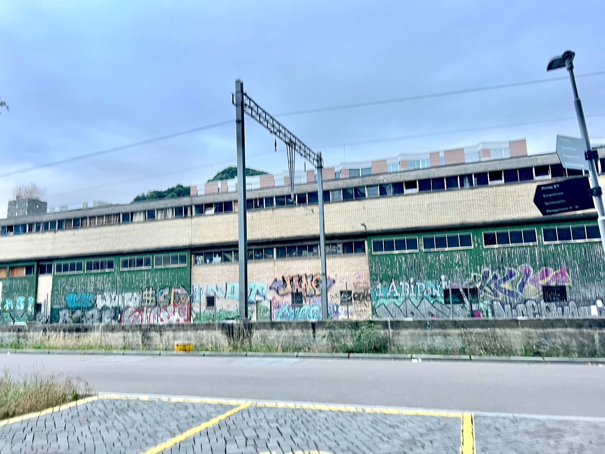 The view across the street from the Meininger hostel in Zurich. It is an abandoned building with graffiti all over it.