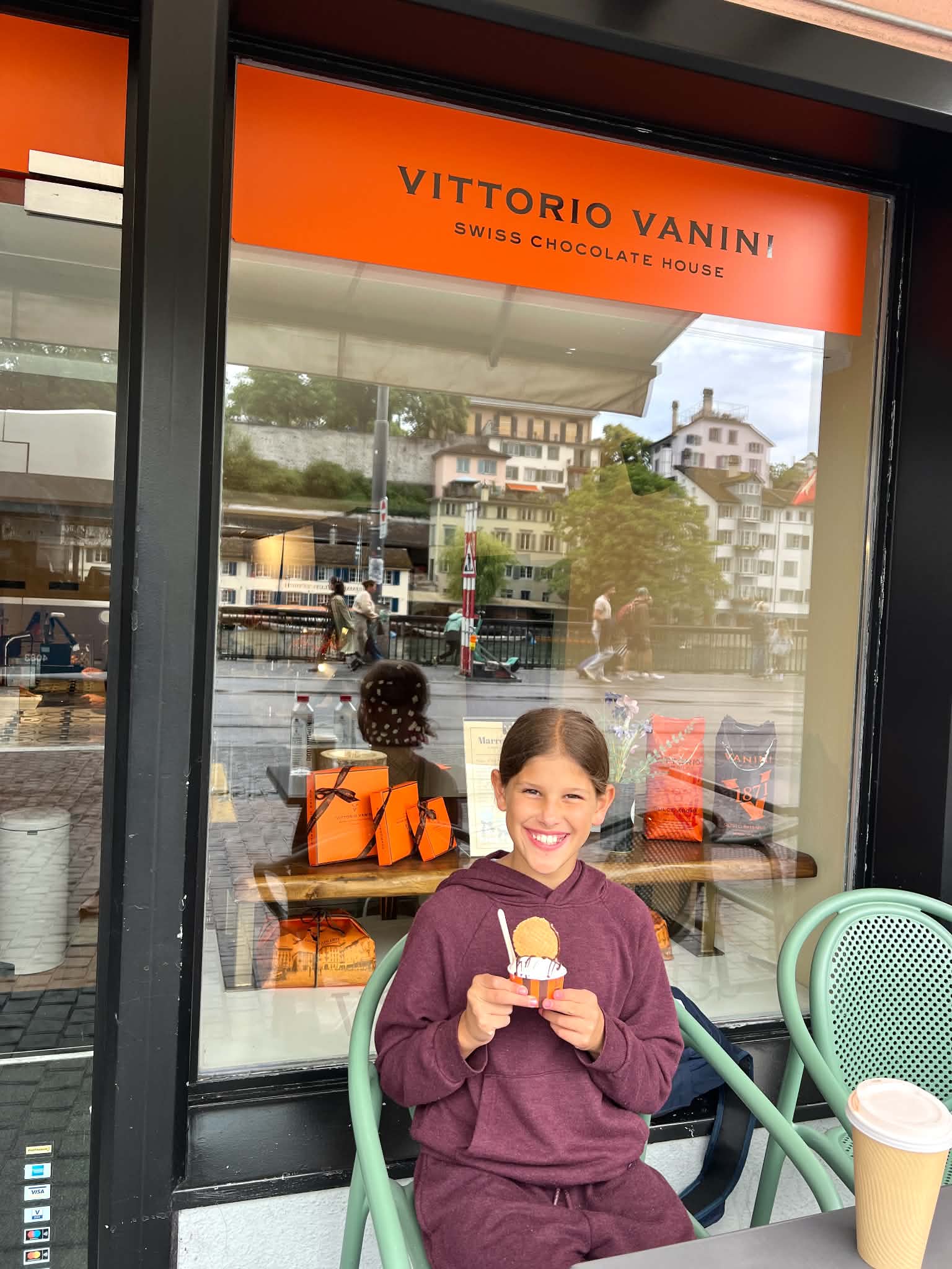A little girl holding up her ice cream that she bought from Vittorio Vanini in Zurich, Switzerland.