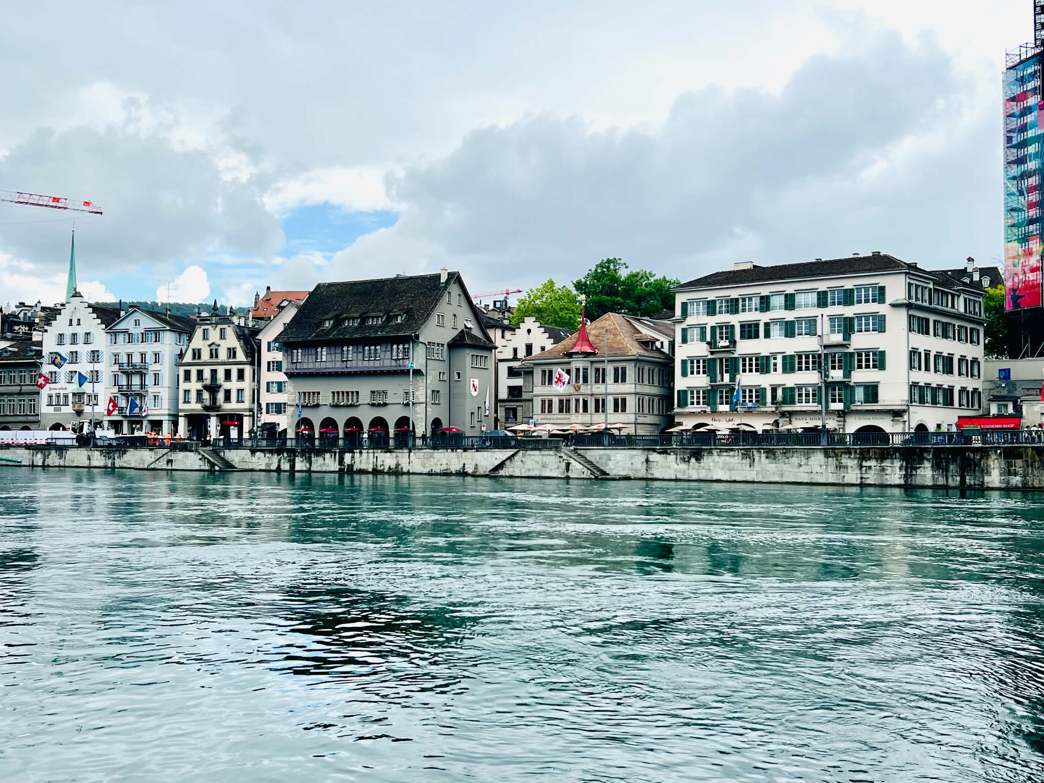 Beautiful multi-color buildings lining the canals of Lake Zurich.