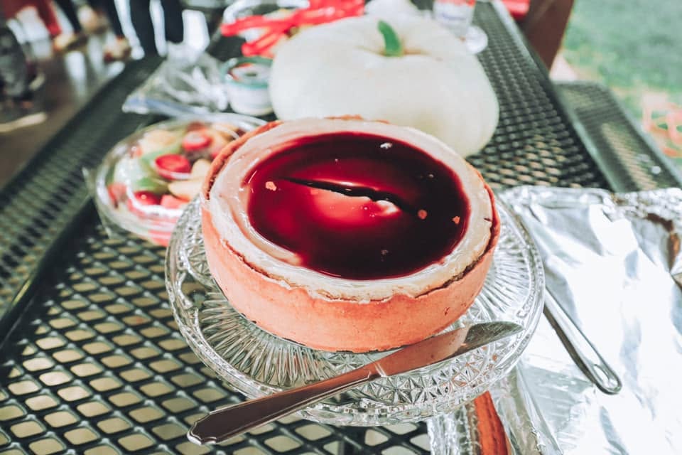 A beautiful pomegranate cheesecake on display.