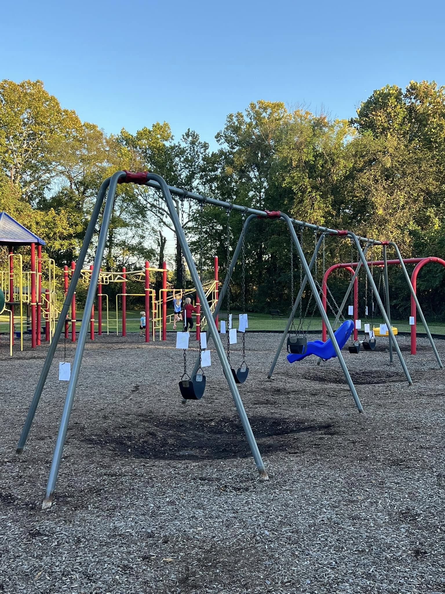 Clues all over the swings at the Feast of Trumpets scavenger hunt.