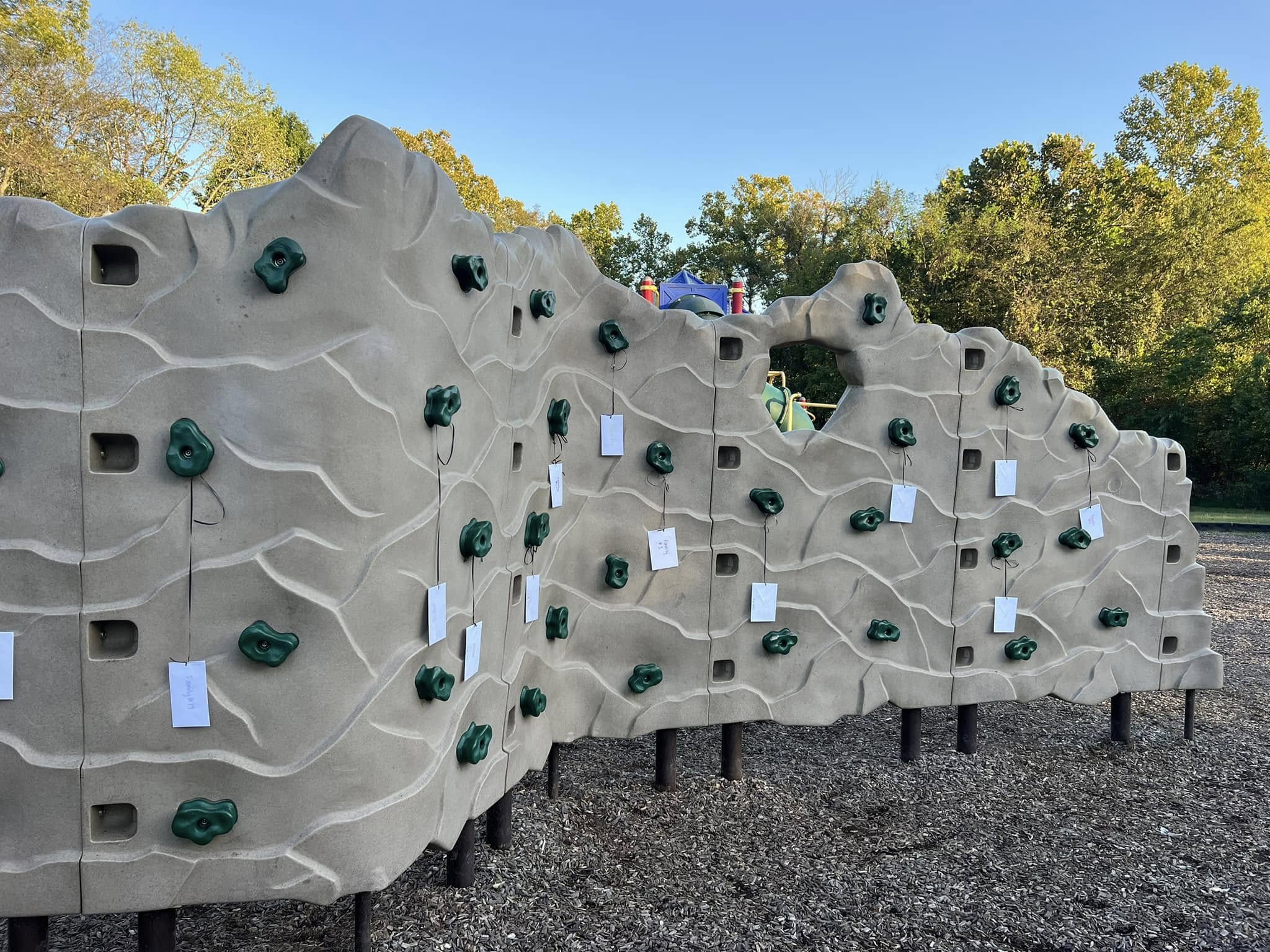 Clues put all over a rock climbing wall for the Feast of Trumpets Scavenger Hunt.