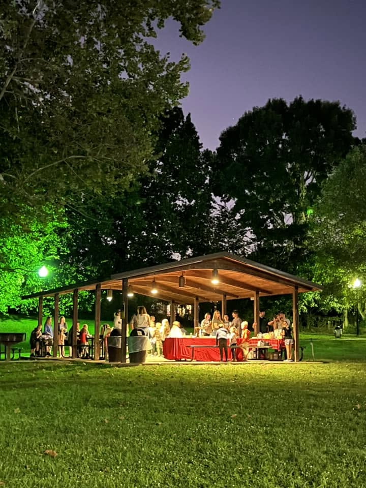 Feast of Trumpets is all about Jesus celebration at the park. People are gathered under a pavilion with pretty lights.